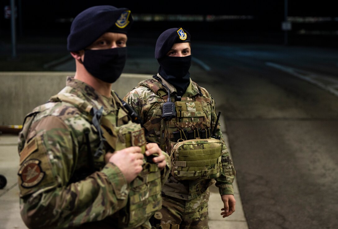 U.S. Air Force Staff Sgt. Jacob Swisher, 88th Security Forces Squadron base defense operations center controller, front, and Airman 1st Class Jadon Dix, 88th SFS entry controllers and alarm monitor, watch for incoming traffic at gate 19B, March 16, 2021 at Wright-Patterson Air Force Base, Ohio. Security Forces members are responsible for providing base defense, as well as providing law enforcement on the installation. (U.S. Air Force photo by Wesley Farnsworth)