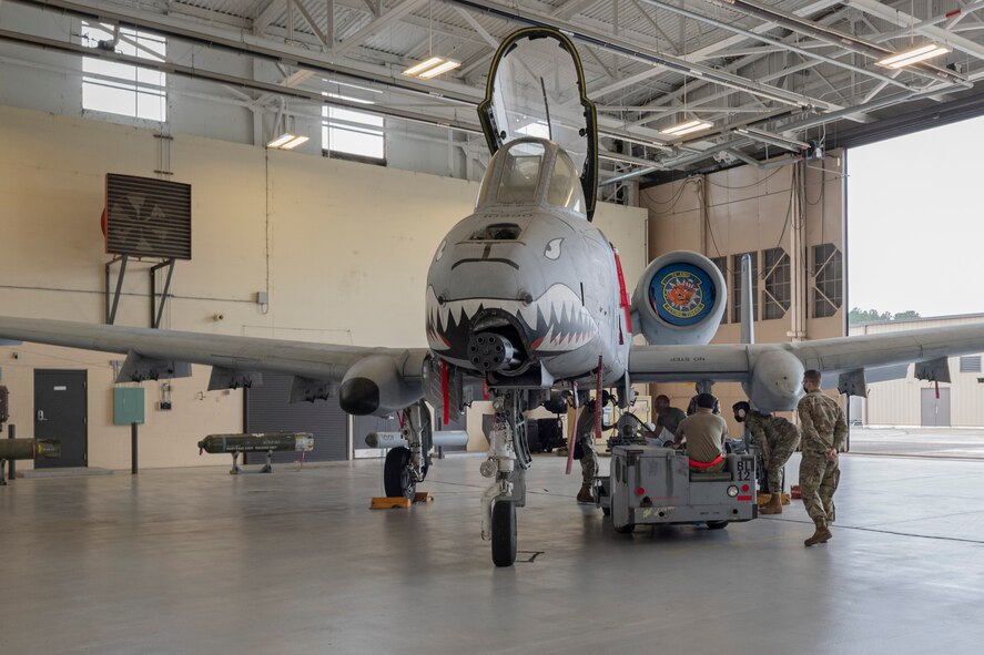Photo of Airmen participating in the Hawgsmoke 2021 Weapons Load Competition
