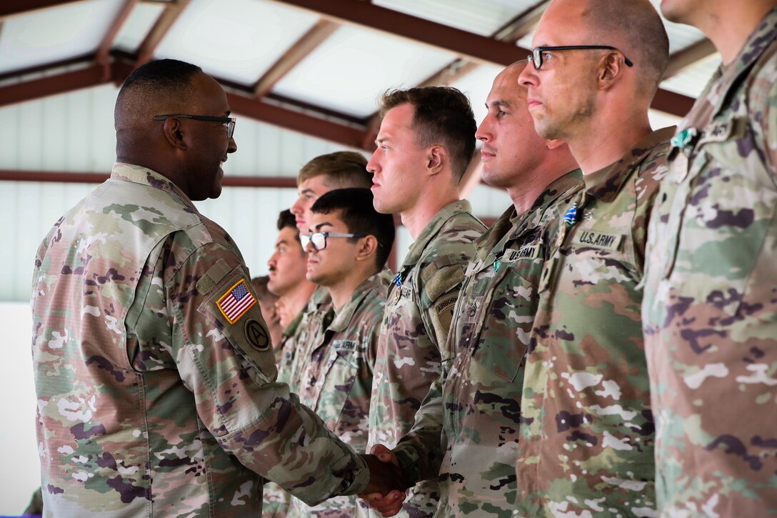 U.S. Army Reserve Command Sgt. Maj, Petter Trotter, the senior enlisted leader of U.S. Army Civil Affairs and Psychological Operations Command (Airborne), congratulates the competing participants of the 2021 U.S. Army Civil Affairs and Psychological Operations Command (Airborne) Best Warrior Competition at Fort Jackson, S.C., April 10, 2021. The USACAPOC(A) BWC is an annual competition that brings in competitors from across USACAPOC(A) to earn the title of “Best Warrior.” BWC tests the Soldiers’ individual ability to adapt and overcome challenging scenarios and battle-focused events, testing their technical and tactical skills under stress and extreme fatigue.