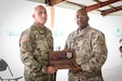 Staff Sgt. Jonathan Chacon, left, a civil affairs specialist with the 426th Civil Affairs Battalion (Airborne), is awarded a plaque from Command Sgt. Maj, Petter Trotter, the senior enlisted leader of United States Army Civil Affairs and Psychological Operations Command (Airborne), for being named NCO of the Year during the 2021 U.S. Army Civil Affairs and Psychological Operations Command (Airborne) Best Warrior Competition at Fort Jackson, S.C., April 10, 2021. The USACAPOC(A) BWC is an annual competition that brings in competitors from across USACAPOC(A) to earn the title of “Best Warrior.” BWC tests the Soldiers’ individual ability to adapt and overcome challenging scenarios and battle-focused events, testing their technical and tactical skills under stress and extreme fatigue.