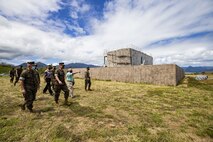 Dan Geltmacher, range and training manager, Marine Corps Base Hawaii, leads a tour of the new Military Operations on Urbanized Terrain during U.S. Marine Corps Brig. Gen. Christopher McPhillips', commanding general, 1st Marine Aircraft Wing, Okinawa, Japan, visit to MCBH, April 13, 2021. The purpose of this visit was to inform senior leaders and staff on the installation’s roles, missions, and capabilities, as well as highlight the ways in which it supports operational forces, their families, and the surrounding community. (U.S. Marine Corps photo by Lance Cpl. Samantha Sanchez)