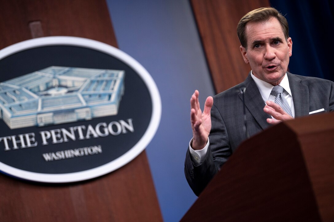 A man briefs the media inside the Pentagon.