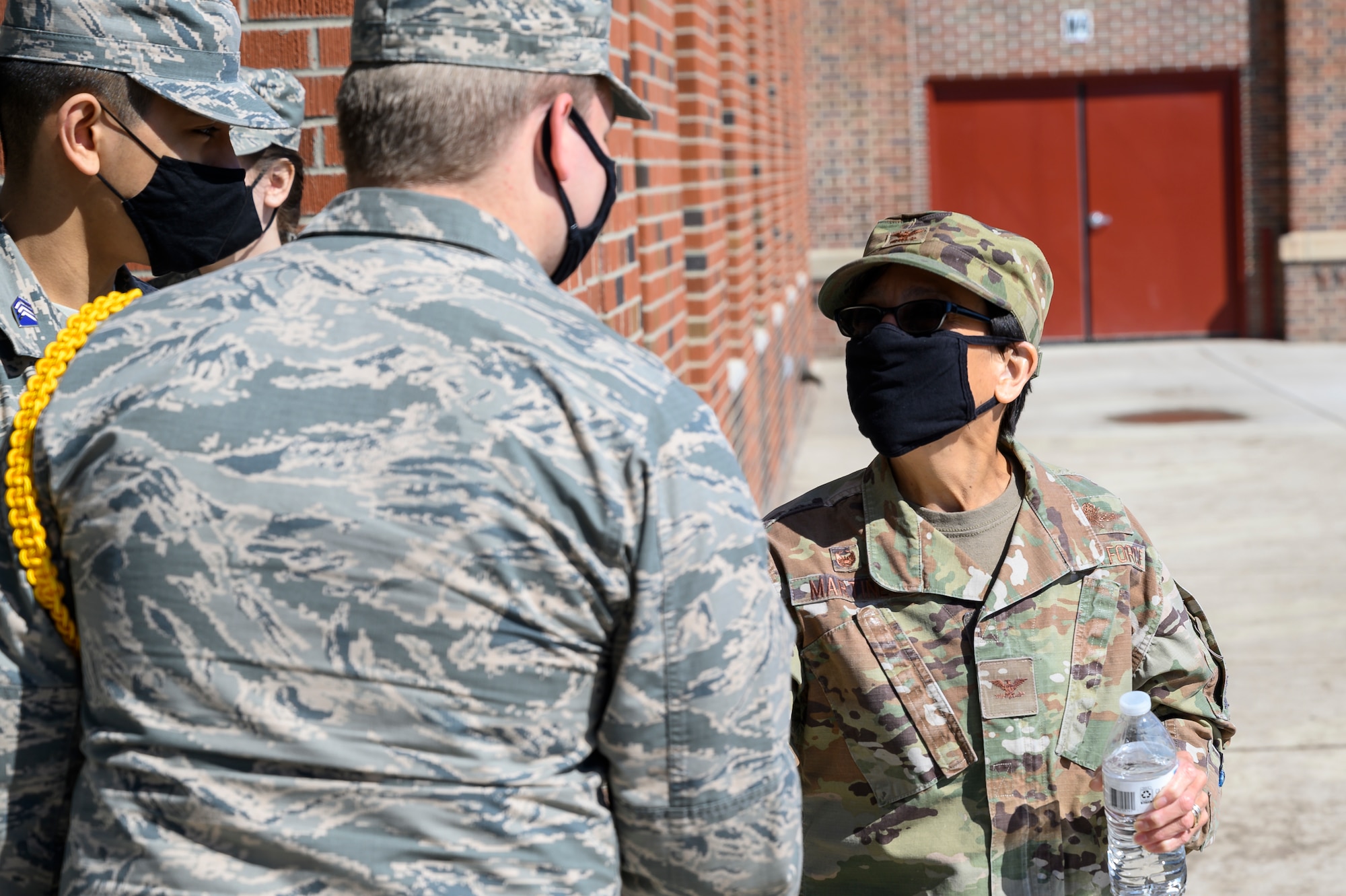 Col. Lisa Martinez, 341st Mission Support Group commander, meets JROTC cadets April 16, 2021, during a visit at Great Falls High School, Mont.