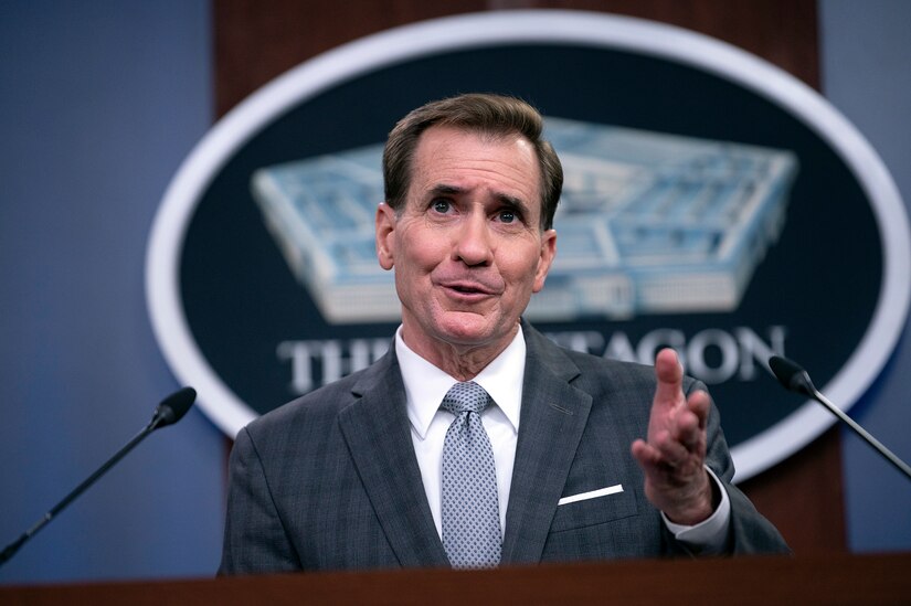 A man briefs the media inside the Pentagon.