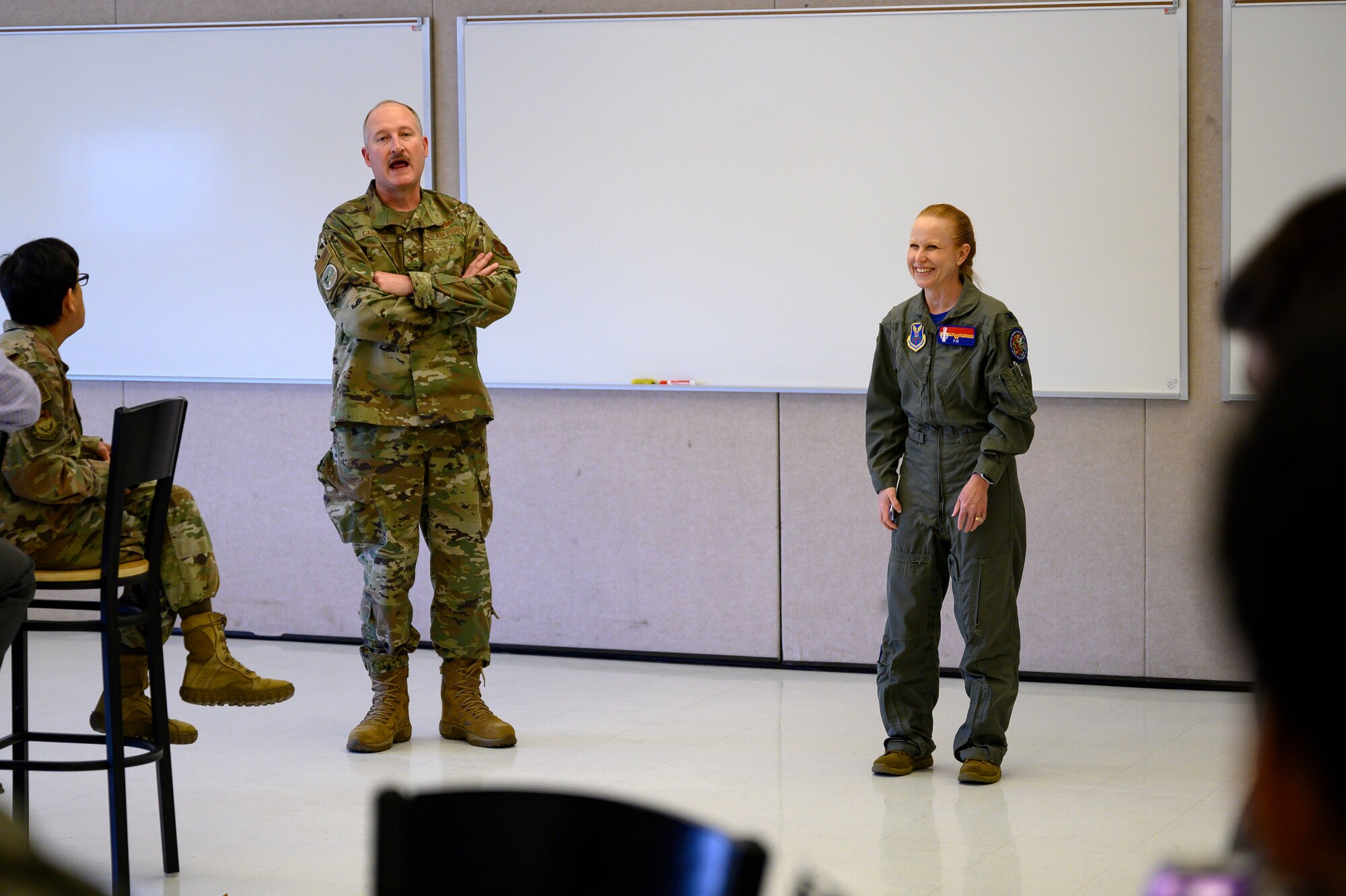 Col. Jeffery Carlton, 120th Airlift Wing vice commander, left, Col. Anita Feugate Opperman, 341st Missile Wing commander, speak to JROTC cadets April 16, 2021, at Great Falls High School, Mont.