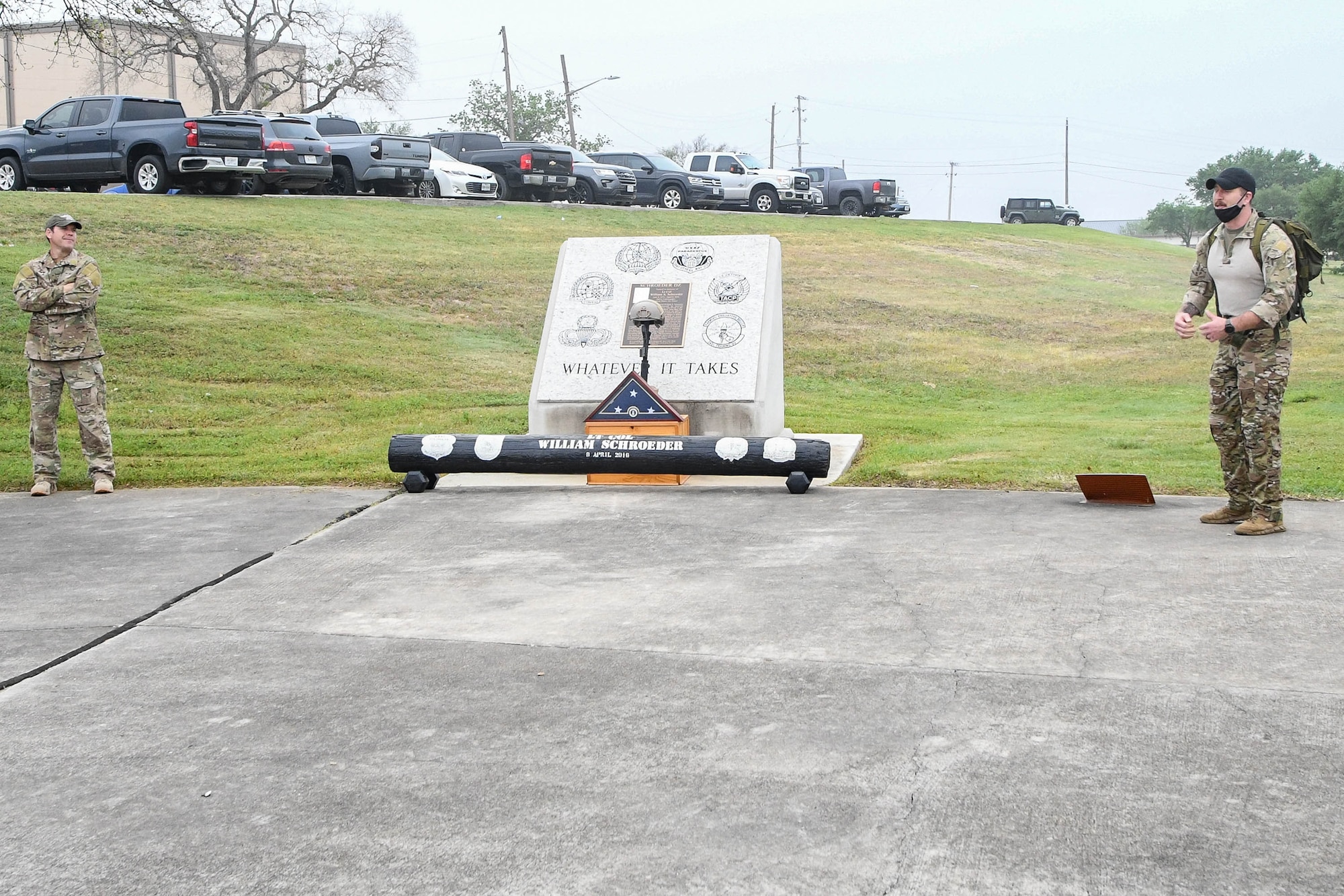 JOINT BASE SAN ANTONIO-CHAPMAN TRAINING ANNEX, Texas—Chief Master Sgt. Todd M. Popovic, Special Warfare Training Wing, or SWTW, command chief, leads a formation in memorial pushups after a memorial log carry for fallen airman, Lt. Col. William Schroeder, at the SWTW located on Joint Base San Antonio-Chapman Training Annex, or JBSA-CTA, Apr. 8, 2021.