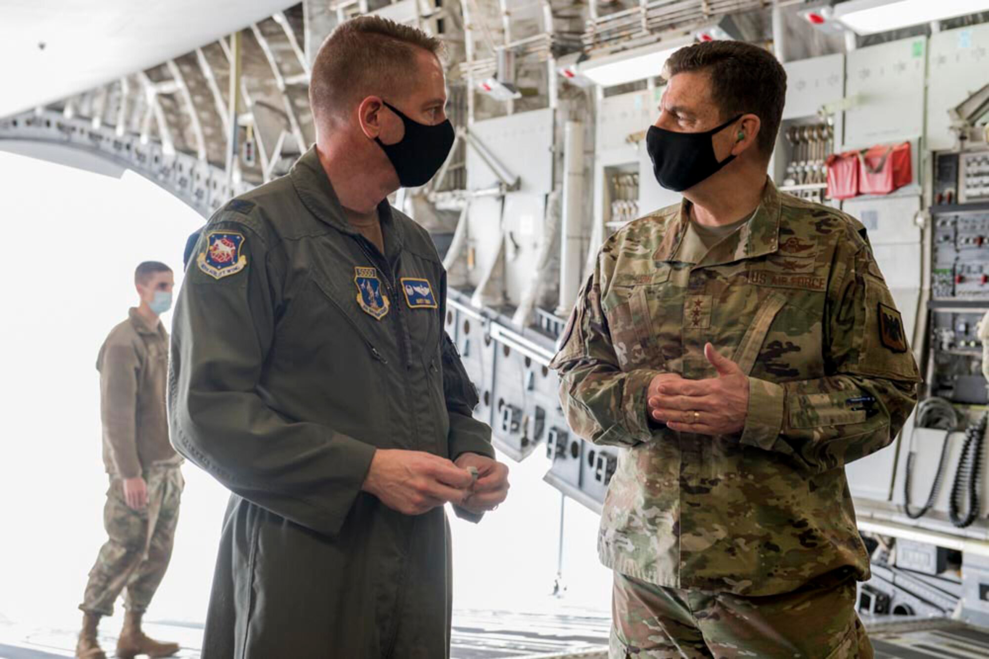 U.S. Air Force Col. Marty Timko, left, wing commander, 167th Airlift Wing, West Virginia National Guard, and Lt. Gen. Michael A. Loh, director, Air National Guard, speak in the cargo area of a C-17 Globemaster III aircraft during Loh’s visit at Shepherd Field Air National Guard Base in Martinsburg, West Virginia, March 9, 2021. During his visit, Loh received updates on the unit’s current operations and response to the COVID-19 pandemic