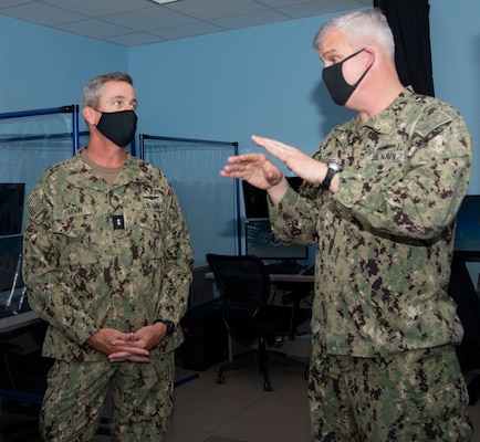 Newport, R.I. (April 13, 2021) Capt. Christopher Alexander, commanding officer, Surface Warfare Schools Command (SWSC), right, gives Rear Adm. Pete Garvin, commander, Naval Education and Training Command, a tour of SWSC during a visit to Naval Station (NAVSTA) Newport R.I., April 13. While onboard NAVSTA Newport, Garvin also visited Navy Supply Corps School, Center for Service Support, Naval Chaplaincy School and Center, and the Senior Enlisted Academy.  (U.S. Navy photo by Mass Communication Specialist 2nd Class Derien C. Luce)