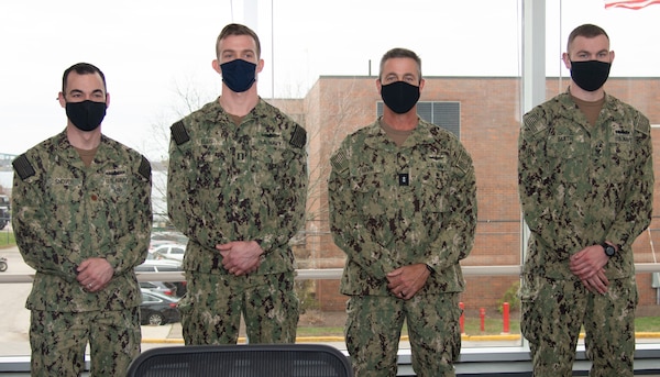 Newport, R.I. (April 13, 2021) Rear Adm. Pete Garvin, commander, Naval Education and Training Command, second from right, poses with Surface Warfare Schools Command staff and students during a visit to Naval Station (NAVSTA) Newport R.I., April 13. While onboard NAVSTA Newport, Garvin also visited Navy Supply Corps School, Center for Service Support, Naval Chaplaincy School and Center, and the Senior Enlisted Academy.  (U.S. Navy photo by Mass Communication Specialist 2nd Class Derien C. Luce)