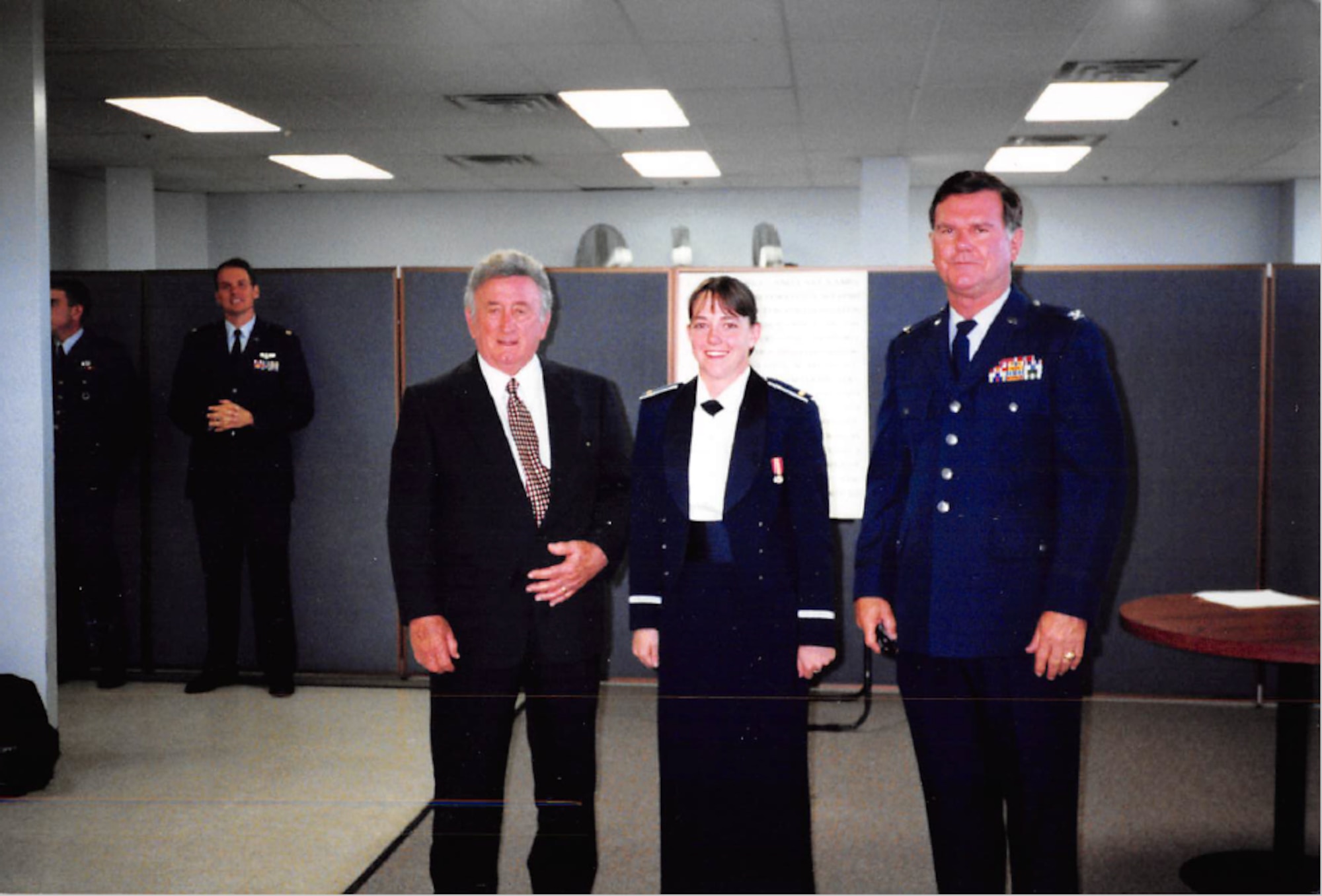 Family members gather after a cadet graduates from the Air Force Academy.