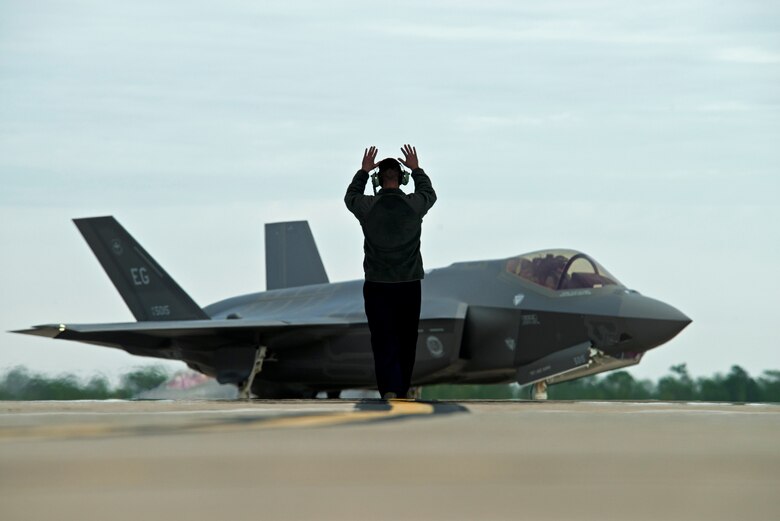 A contracted logistics maintenance personnel from Lockheed Martin taxis in a F-35A Lightning II after a training sortie at Eglin Air Force Base, Fl. Maintainers of the 58th Fighter Squadron work along side counterparts from Lockheed Martin to ensure proper evaluation and training for the F-35 aircraft.  (U.S. Air Force photo/Tech. Sgt. Bennie J. Davis III)