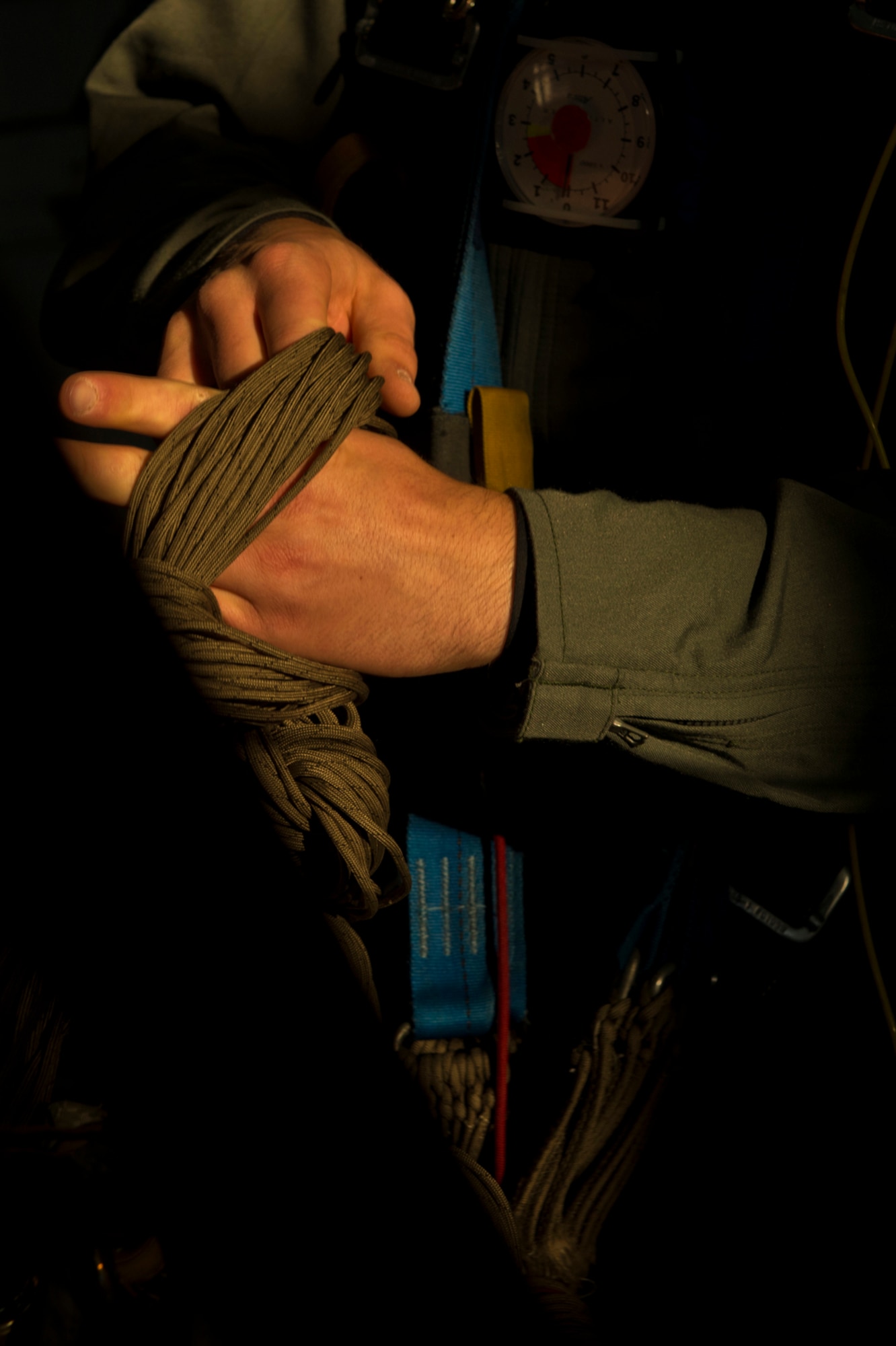 A U.S. Air Force Academy cadet learns to pack and organize parachute cords before a morning jump in the 490 AM program. Cadets learn every aspect of parachuting and are responsible for packing their own gear. (U.S. Air Force photo/Tech. Sgt. Bennie J. Davis III)