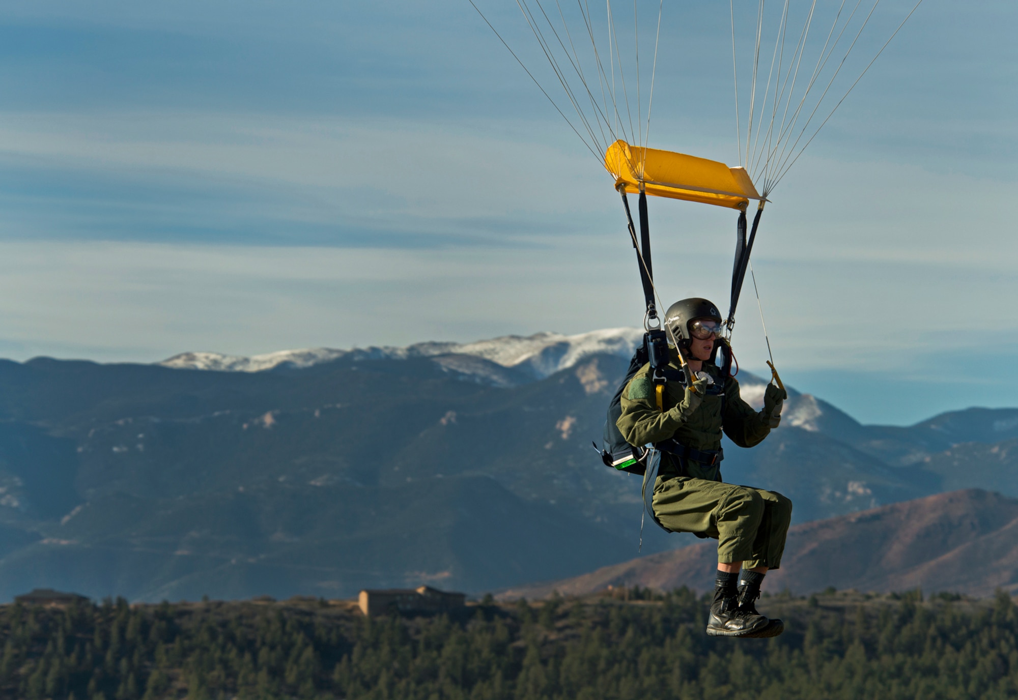 MidshipmanTaylor Vendetta, of the U.S. Navel Academy, prepares to land his first free-fall jump from the U.S. Air Force Academy's AM490 Basic Parachuting course. The AM490 students are taken to 4,500 feet and they stand in the door over Colorado Springs and the Rockie Mountains and jump. The course focuses on safety and emergency procedures to aid the students' ability to overcome their fears and perform under the extremely stressful and potentially life-threatening situations they may encounter.(U.S. Air Force photo/Tech. Sgt. Bennie J. Davis III)