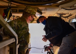 Brian L. Debutts, logistics assistance representative, 401st Army Field Support Brigade, advises Sgt. Tommy D. Riddick, U.S. Army Signal Support Systems specialist, on the proper operation of a Single Channel Ground and Airborne Radio System/ Advanced Session Initiation Protocol at Erbil Ari Base, Iraq, Feb. 23. LARs like Debutts specialize in providing technical assistance to Soldiers on everything from communications and electronics to tracked vehicles and armament.