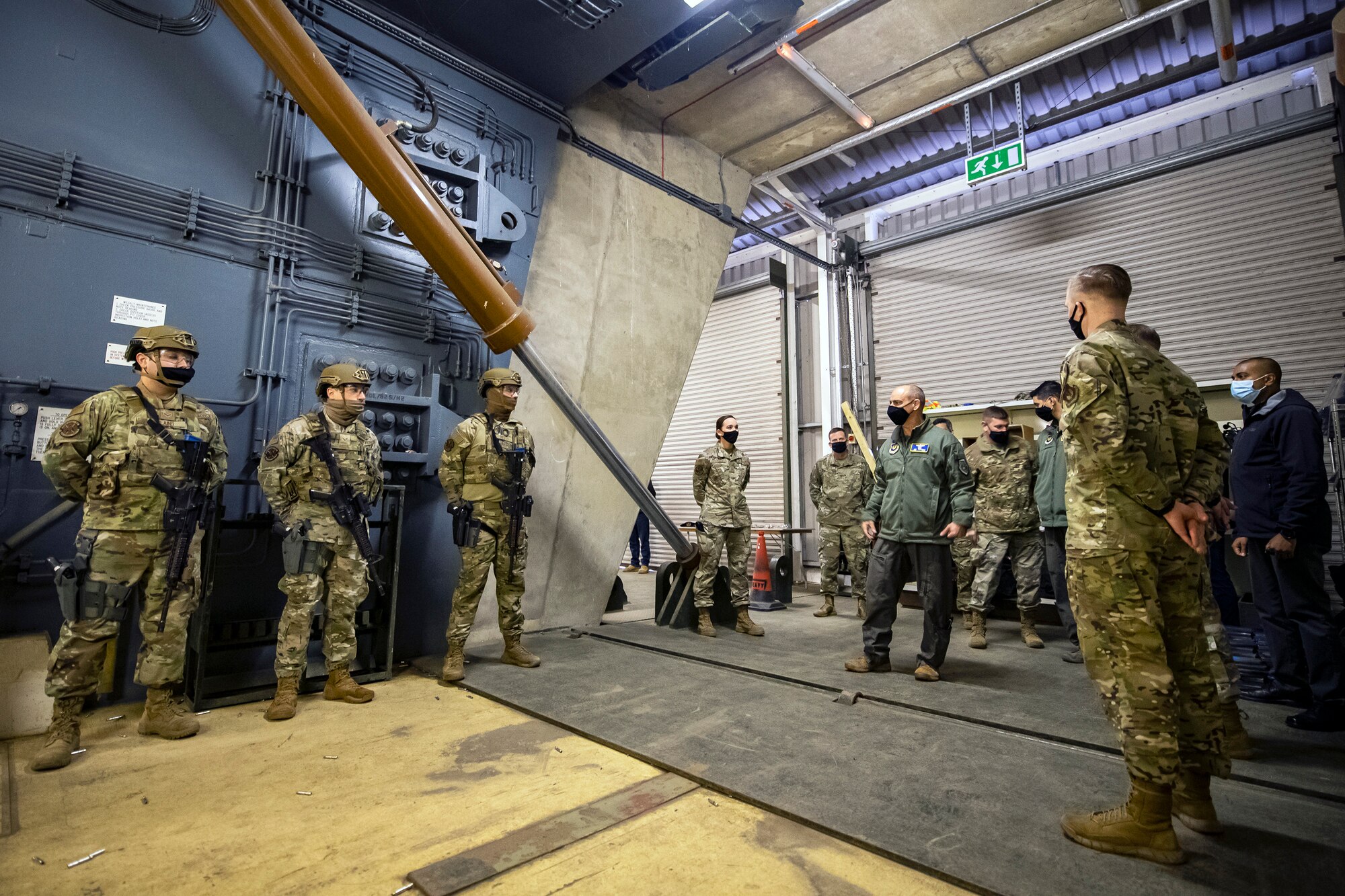 U.S. Air Force Gen. Jeff Harrigian, center right, U.S. Air Forces in Europe and Air Forces Africa commander, speaks with Airmen from the 423rd Security Forces Squadron at RAF Molesworth, England, April 15, 2021. During his visit, Harrigian was able to speak with defenders from the 423rd SFS, observe a tactical exercise and shoot an M4 carbine. (U.S. Air Force photo by Senior Airman Eugene Oliver)