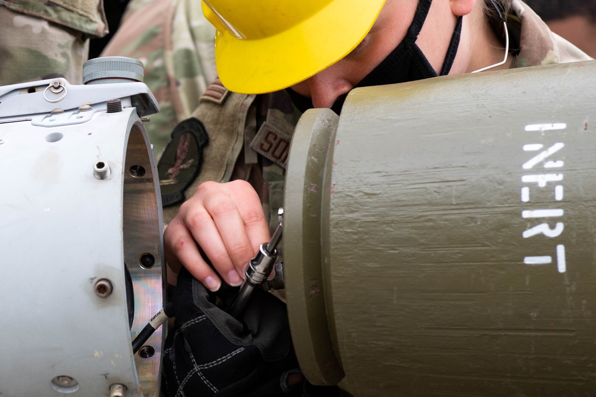 Airman 1st Class Danielle Sonnenberg, 51st Munitions Squadron, competes in the Load Crew of the Quarter Competition at Osan Air Base, Republic of Korea, April 16, 2021. Munitions Systems Airmen compete to build munitions the fastest. (U.S. Air Force photo by Senior Airman Kevyn Allen)