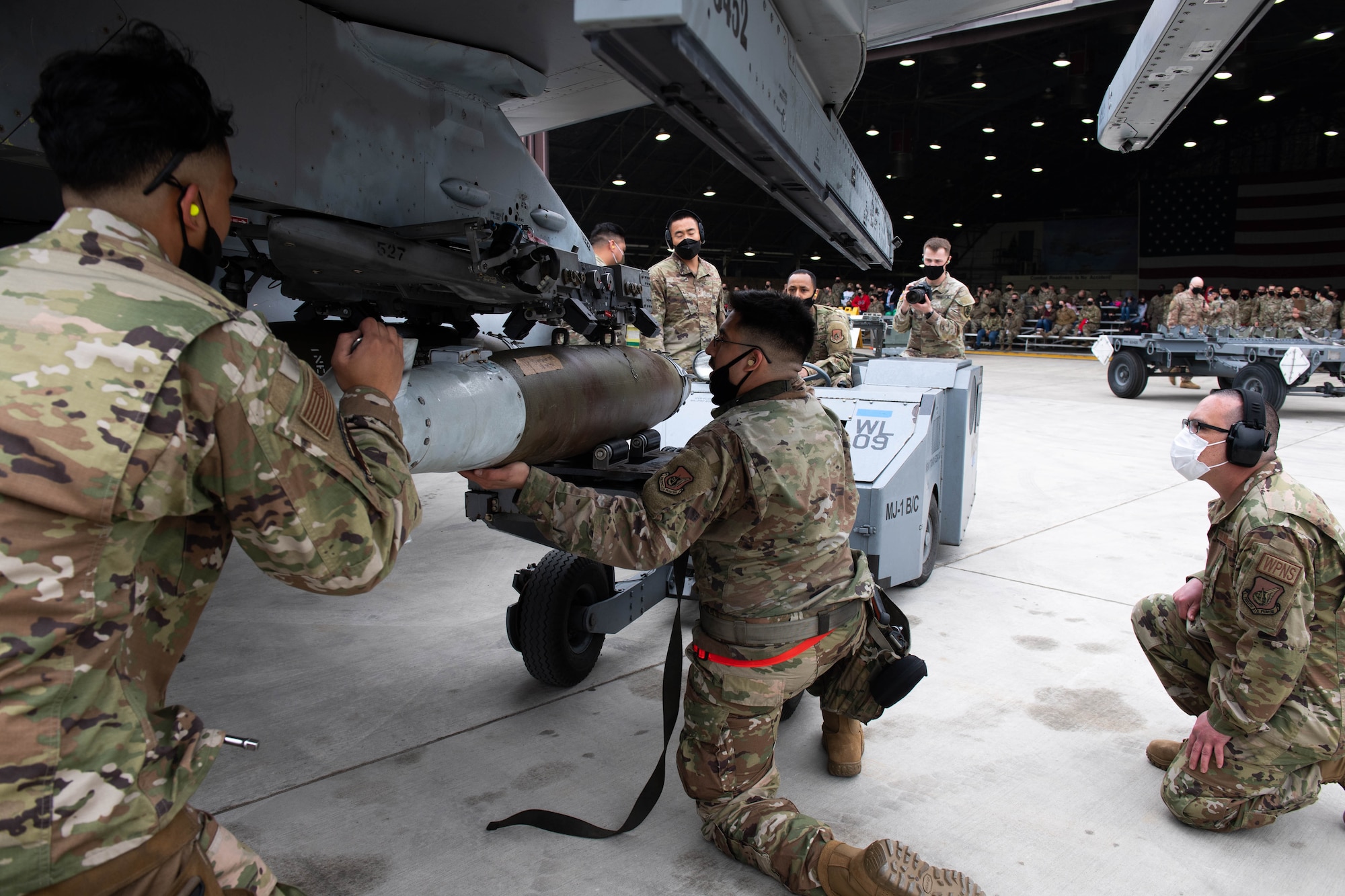 Airmen from the 36th Aircraft Maintenance Unit compete in the Load Crew of the Quarter Competition at Osan Air Base, Republic of Korea, April 16, 2021.  This competition is held by the 51st Maintenance Group to showcase their squadrons abilities and foster morale. (U.S. Air Force photo by Senior Airman Kevyn Allen)