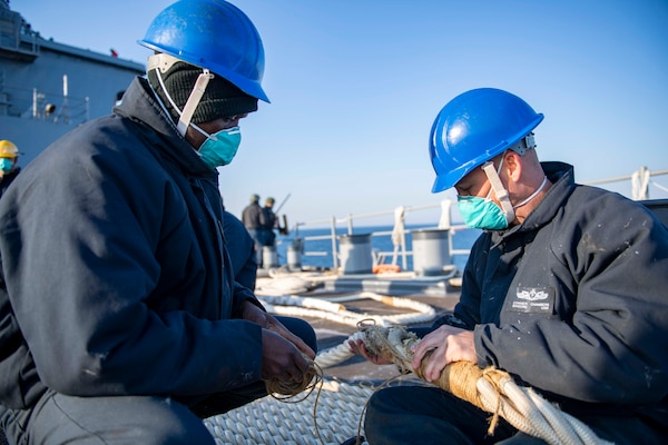 210417-N-NQ285-1054
PLYMOUTH, England (April 17, 2021) Seaman Abdul Mohammed, left, and Boatswain's Mate 2nd Class Conner Chambers, both assigned to the Harpers Ferry-class dock landing ship USS Carter Hall (LSD 50), maintain a line during a sea and anchor evolution, April 17, 2021. Carter Hall is operating in the Atlantic Ocean with Amphibious Squadron 4 and the 24th Marine Expeditionary Unit (24th MEU) as part of the Iwo Jima Amphibious Ready Group. (U.S. Navy photo by Mass Communication Specialist Seaman Sawyer Connally)