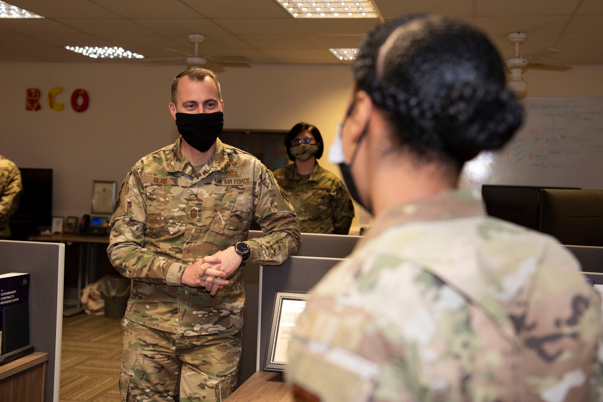 U.S. Air Force Chief Master Sgt. Brion Blais, left, U.S. Air Forces in Europe and Air Forces Africa command chief, meets Airman 1st Class Takeira Ayala, right, 501st Combat Support Wing financial operations technician, during a meeting with the outstanding performers of the 501st CSW wing staff agency at Royal Air Force Alconbury, England, April. 15, 2021. The USAFE-AFAFRICA command team visited the 501st CSW to engage with Airmen and recognize outstanding performers. (U.S. Air Force photo by Senior Airman Jennifer Zima)