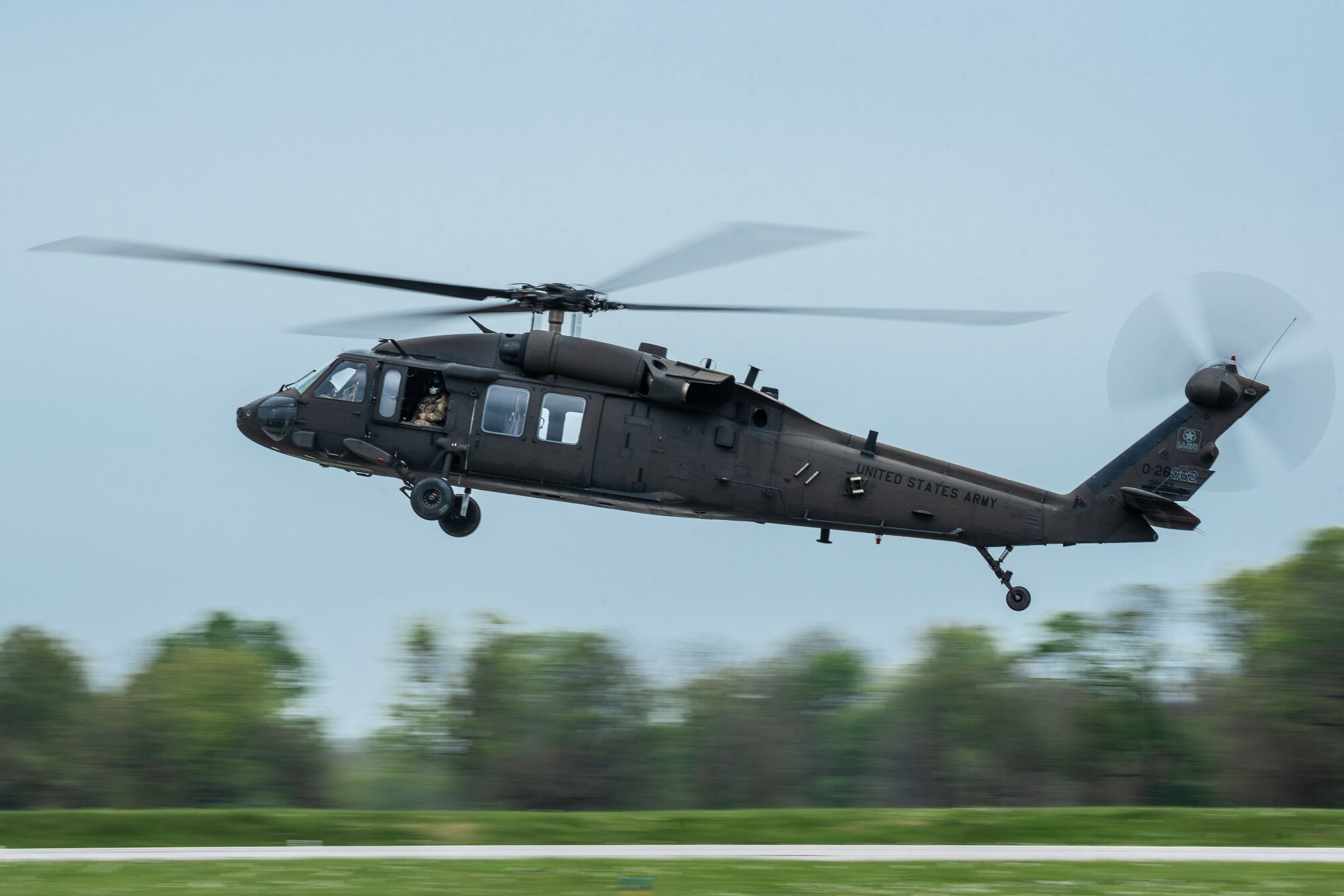 A U.S. Army Reserve UH-60 Blackhawk helicopter performs an aerial demonstration over Bowman Field in Louisville, Ky., April 17, 2021, as part of the Thunder Over Louisville air show. The annual event featured more than 20 military and civilian air craft this year. (U.S. Air National Guard photo by Dale Greer)