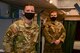 Two 91st Airman pose for a photo inside of a launch control center