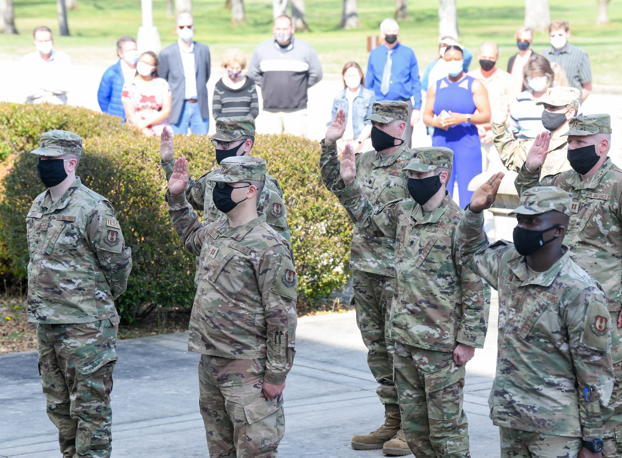 Air Force officers reaffirm their oath of office during a flag retreat ceremony to mark the completion of the Extremism Stand Down exercises, April 6, 2021, at Arnold Air Force Base, Tenn. The importance of the oath of office was a focus of the stand down. (U.S. Air Force photo by Jill Pickett)