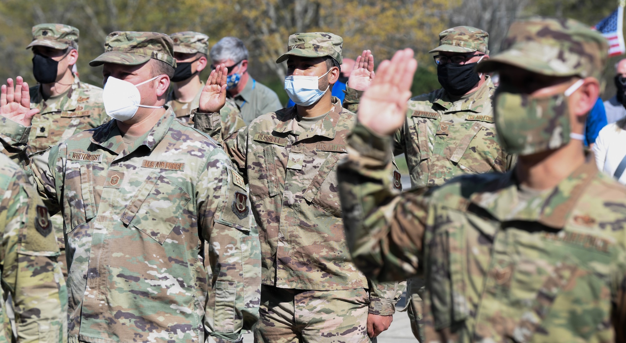 Enlisted Airmen reaffirm their oath of office during a flag retreat ceremony to mark the completion of the Extremism Stand Down exercises, April 6, 2021, at Arnold Air Force Base, Tenn. The importance of the oath of office was a focus of the stand down. (U.S. Air Force photo by Jill Pickett)