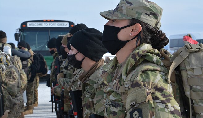 Soldiers with the California Army National Guard's 330th Military Police Company arrive at Fairbanks International Airport in Alaska, March 30. These Soldiers will integrate with the Military Ground-based Interceptor Security Company, 49th Missile Defense Battalion, Alaska National Guard, at Fort Greely, to guard and defend the expanding Missile Defense Complex. (U.S. Army Reserve photo by 2nd Lt. Desirae Garcia)