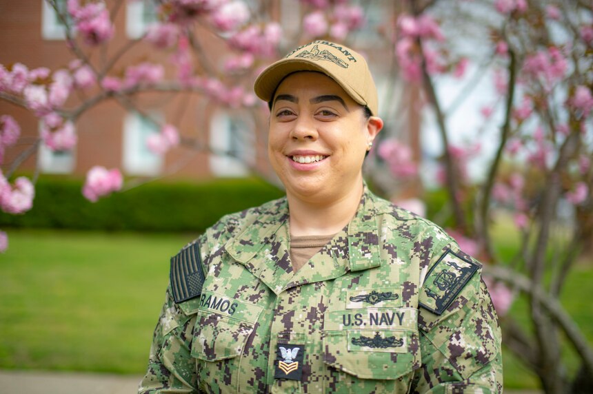 Information Systems Technician 1st Class Corinna Ramos, assigned to Commander, Submarine Force Atlantic (COMSUBLANT), stands outside of COMSUBLANT headquarter in Norfolk, Va., April 15, 2021.