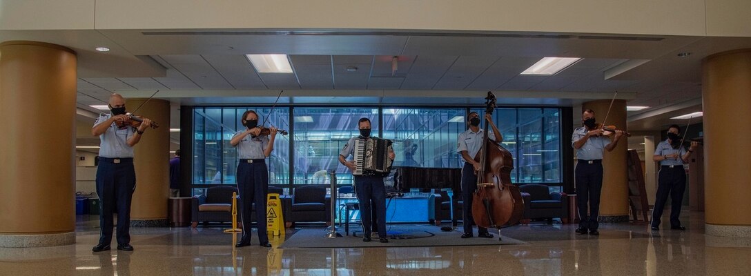 The Air Force Strings have performed monthly in several areas of the Walter Reed National Military Medical Center since 2019, but due to COVID-19, their mission took a hiatus. The Strings were invited to return in July of 2020 and were the first group to provide live music since the beginning of the pandemic. (Photo by Mass Communications Specialist 2nd Class Kurtis A. Hatcher)