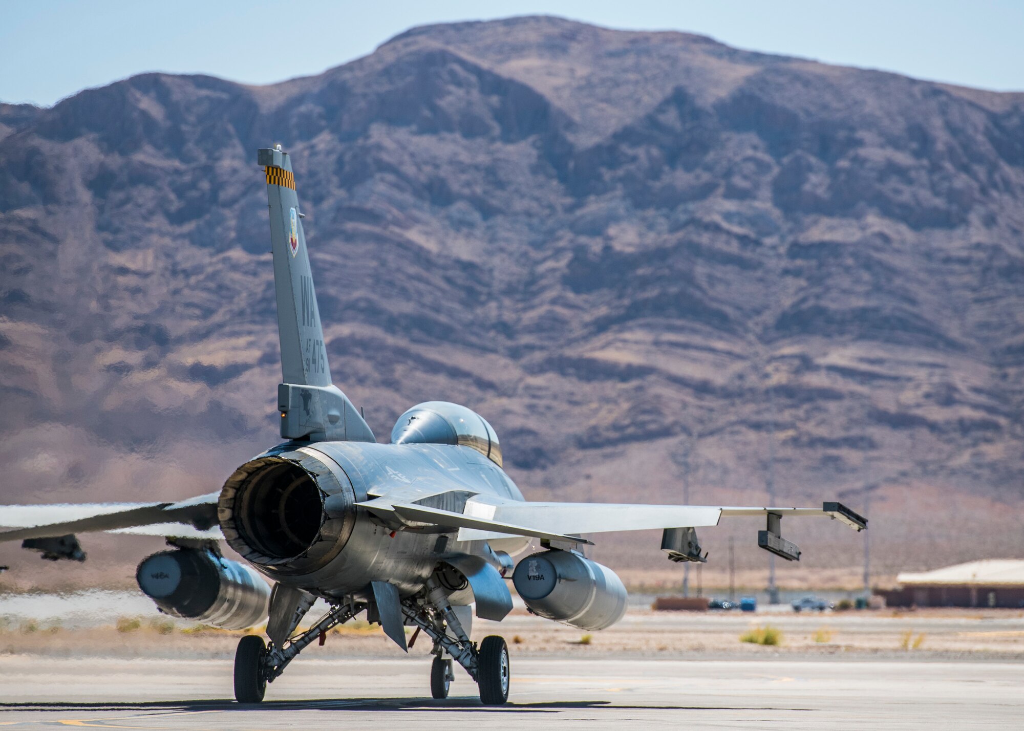 An F-16 fighting falcon taxis out during a training exercise, April 10, 2021 at Nellis Air Force Base, Nev. The 926th AMXS conducted an operations exercise to maintain steadfast readiness that relate to real world day-to-day functions.