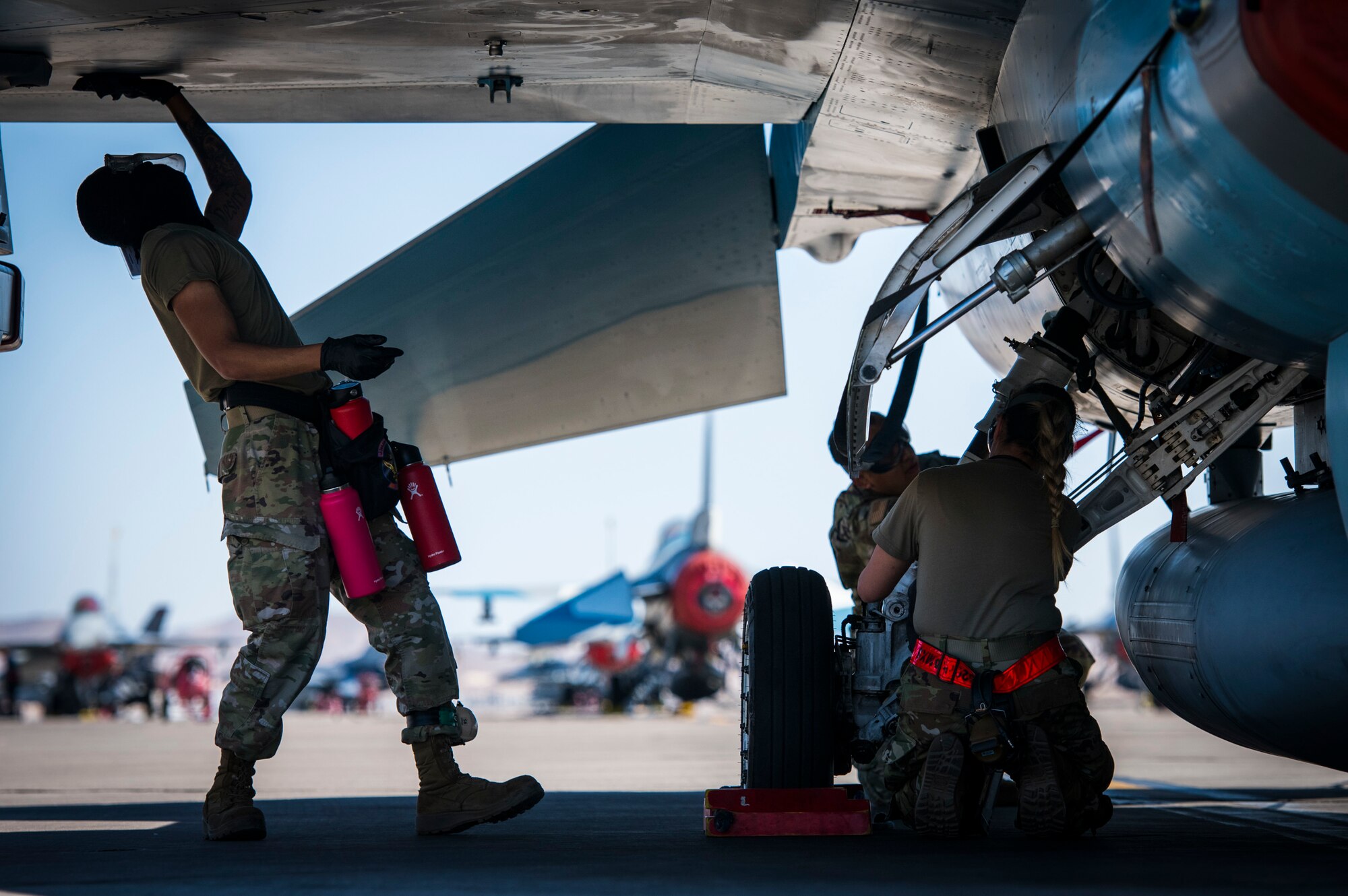 926th Aircraft Maintenance Squadron Airmen utilize cleaning applicant to the F-16 during a training exercise, April 10, 2021 at Nellis Air Force Base, Nev. The 926th AMXS conducted an operations exercise to maintain steadfast readiness that relate to real world day-to-day functions.