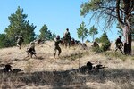 South Dakota Army National Guardsmen respond to simulated direct fire at West Camp Rapid in Rapid City, S.D., April 10, 2021. The 35th Military Police Detention Company rehearsed mission essential tasks during a field training exercise to prepare for its state and federal missions.