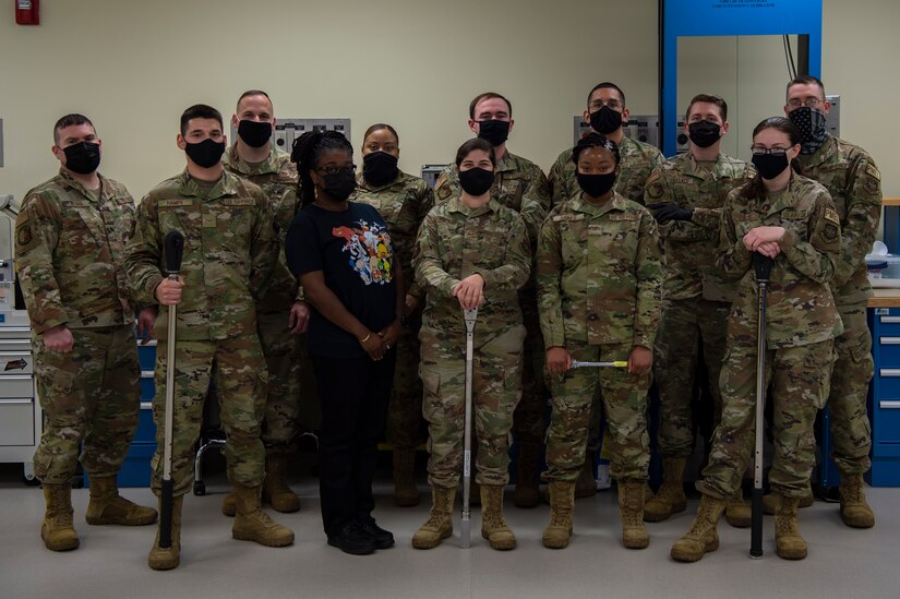 U.S. Air Force Airman from the 437th Precision Measurement Equipment Laboratory pose for a group photo at Joint Base Charleston, S.C. April 12, 2021. Test measurement and diagnostic equipment is used to accurately measure, calibrate, and test equipment or tools that might need repair.