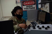 U.S. Air Force Airman 1st Class Ayanna Gaines a test measurement and diagnostic equipment (TMDE) Apprentice, applies a known voltage to a known resistance to calibrate the internal current of the radio frequency power meter at Joint Base Charleston, S.C. April 12, 2021. Test measurement and diagnostic equipment is used to accurately measure, calibrate, and test equipment or tools that might need repair