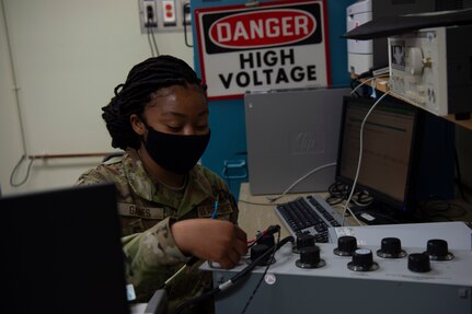 U.S. Air Force Airman 1st Class Ayanna Gaines a test measurement and diagnostic equipment (TMDE) Apprentice, applies a known voltage to a known resistance to calibrate the internal current of the radio frequency power meter at Joint Base Charleston, S.C. April 12, 2021. Test measurement and diagnostic equipment is used to accurately measure, calibrate, and test equipment or tools that might need repair