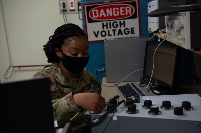 U.S. Air Force Airman 1st Class Ayanna Gaines a test measurement and diagnostic equipment (TMDE) Apprentice, applies a known voltage to a known resistance to calibrate the internal current of the radio frequency power meter at Joint Base Charleston, S.C. April 12, 2021. Test measurement and diagnostic equipment is used to accurately measure, calibrate, and test equipment or tools that might need repair