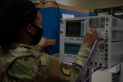 U.S. Air Force Airman 1st Class Ayanna Gaines a test measurement and diagnostic equipment  (TMDE) Apprentice, calibrates a signal generator at Joint Base Charleston, S.C. April 12, 2021. Test measurement and diagnostic equipment is used to accurately measure, calibrate, and test equipment or tools that might need repair.