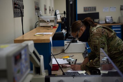 U.S. Air Force Airman 1st Class Desirrae Robinson a test measurement and diagnostic equipment (TMDE) Apprentice, calibrates a torque wrench on a torque measurement system to ensure it is within its designated specifications at Joint Base Charleston, S.C. April 12, 2021. Test measurement and diagnostic equipment is used to accurately measure, calibrate, and test equipment or tools that might need repair.