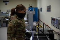 U.S. Air Force Airman 1st Class Desirrae Robinson a test measurement and diagnostic equipment (TMDE) Apprentice, calibrates a torque wrench on a torque measurement system to ensure it is within its designated specifications at Joint Base Charleston, S.C. April 12, 2021. Test measurement and diagnostic equipment is used to accurately measure, calibrate, and test equipment or tools that might need repair.