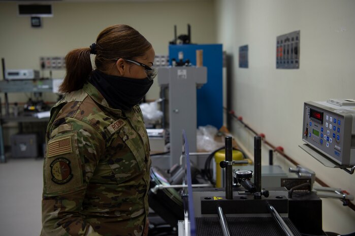 U.S. Air Force Airman 1st Class Desirrae Robinson a test measurement and diagnostic equipment (TMDE) Apprentice, calibrates a torque wrench on a torque measurement system to ensure it is within its designated specifications at Joint Base Charleston, S.C. April 12, 2021. Test measurement and diagnostic equipment is used to accurately measure, calibrate, and test equipment or tools that might need repair.