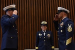 Command Master Chief Petty Officer James Bach passes the watch to Master Chief Petty Officer Jahmal Pereira during the Ninth Coast Guard District's change-of-watch ceremony in Cleveland, June 6, 2018. The ceremony was presided over by the Commander of the Coast Guard's Ninth District, Rear Adm. Joanna Nunan.