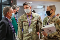 Air Force Detachment Officer in Charge Maj Patrick Kucera (right) and incoming relief Capt. Mark Elliott (center) discuss the Joint Explosive Ordnance Disposal (JEOD) Threat Expo with Naval Surface Warfare Center Indian Head Division (NSWC IHD) JEOD Programs Special Assistant Brett Reissener. NSWC IHD’s EOD Department hosted its third annual EOD Threat Expo at the Stump Neck Annex, April 13-15. (U.S. Navy photo by Matthew Poynor)