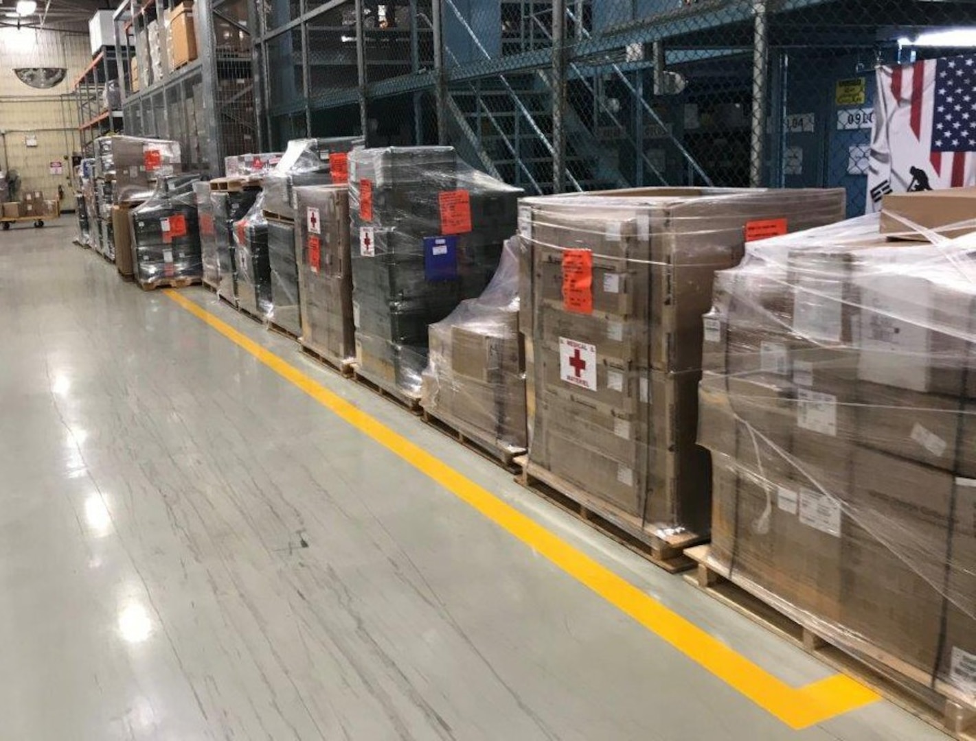 Pallets of medical equipment are prepared for distribution in support of Eighth Army medical units. (Courtesy)
