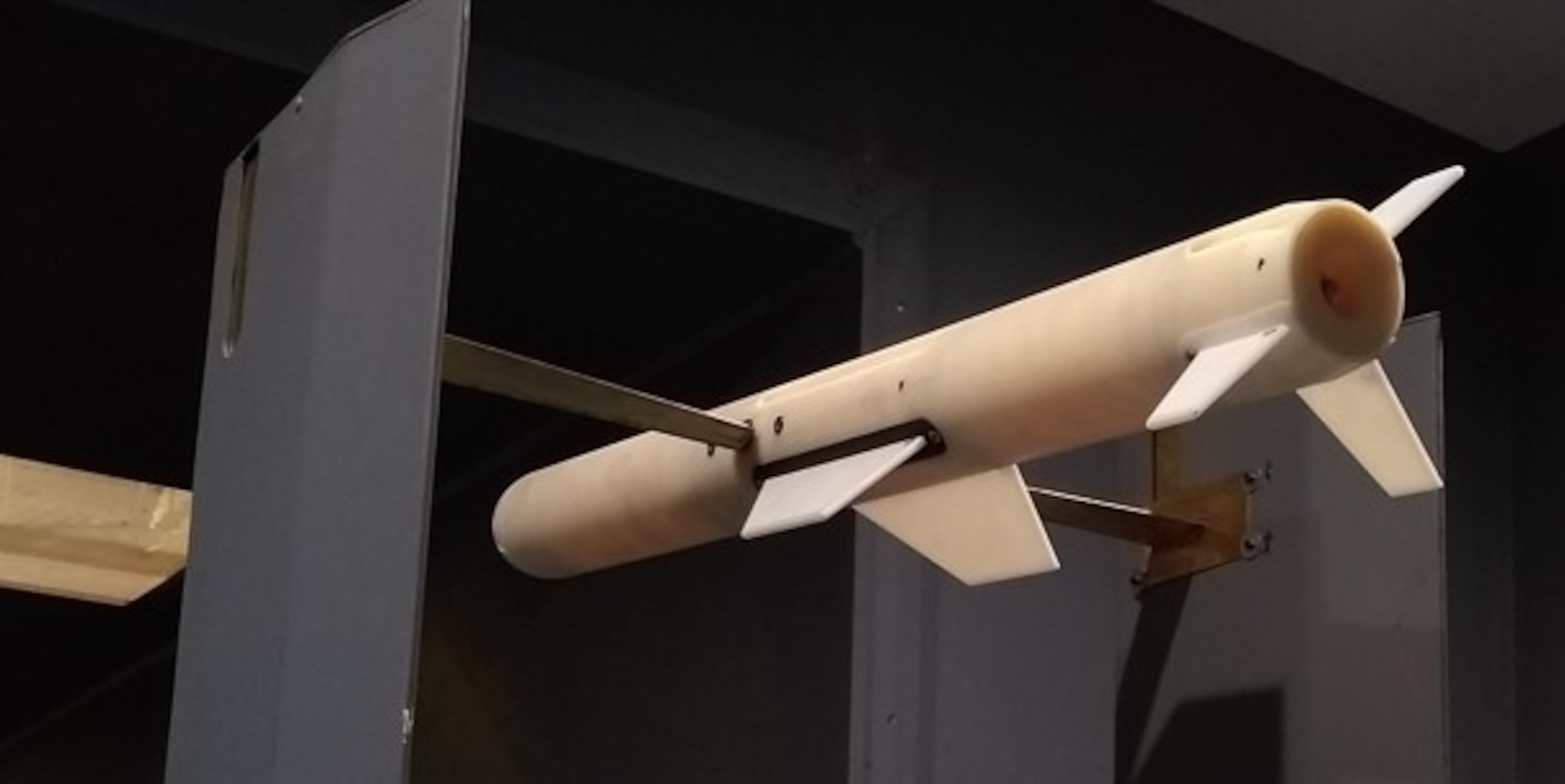 IMAGE: A test model of a damaged missile with a missing wing and tail fin is pictured at West Virginia University’s wind tunnel. Naval Surface Warfare Center Dahlgren Division (NSWCDD) threat engineers are performing analysis to predict the aerodynamics of damaged states systems to produce prototype research methods and simulations. Research conducted by West Virginia University in collaboration with NSWCDD aerospace and threat engineers – especially its wind tunnel testing – is playing a significant role in evaluating the munition effectiveness of nonlethal engagement scenarios in support of the NSWCDD Damaged State Modeling of a Post Intercept Threat Program.