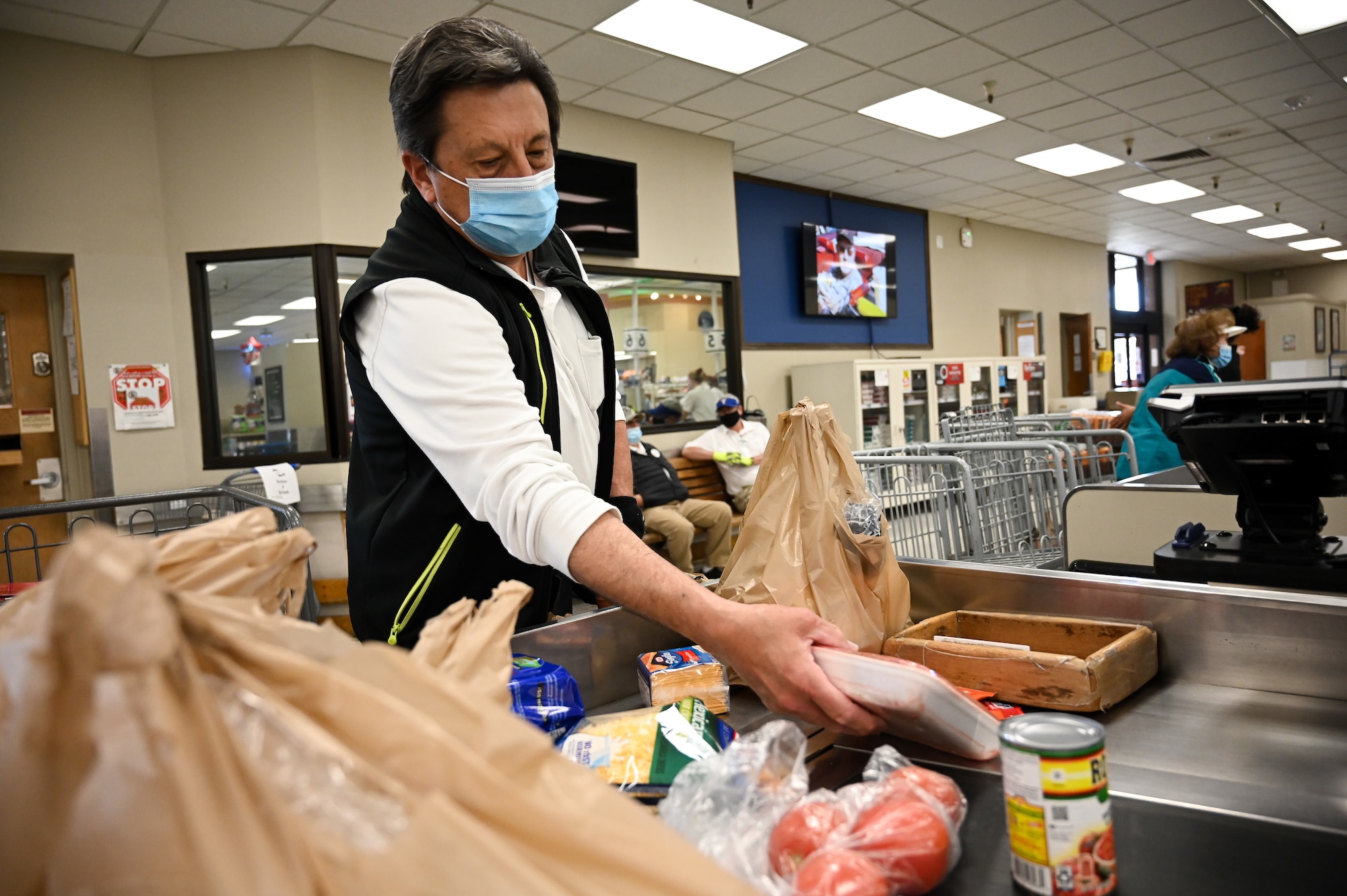 John Ingram bags commissary groceries at Hill Air Force Base, Utah, April 8, 2021.