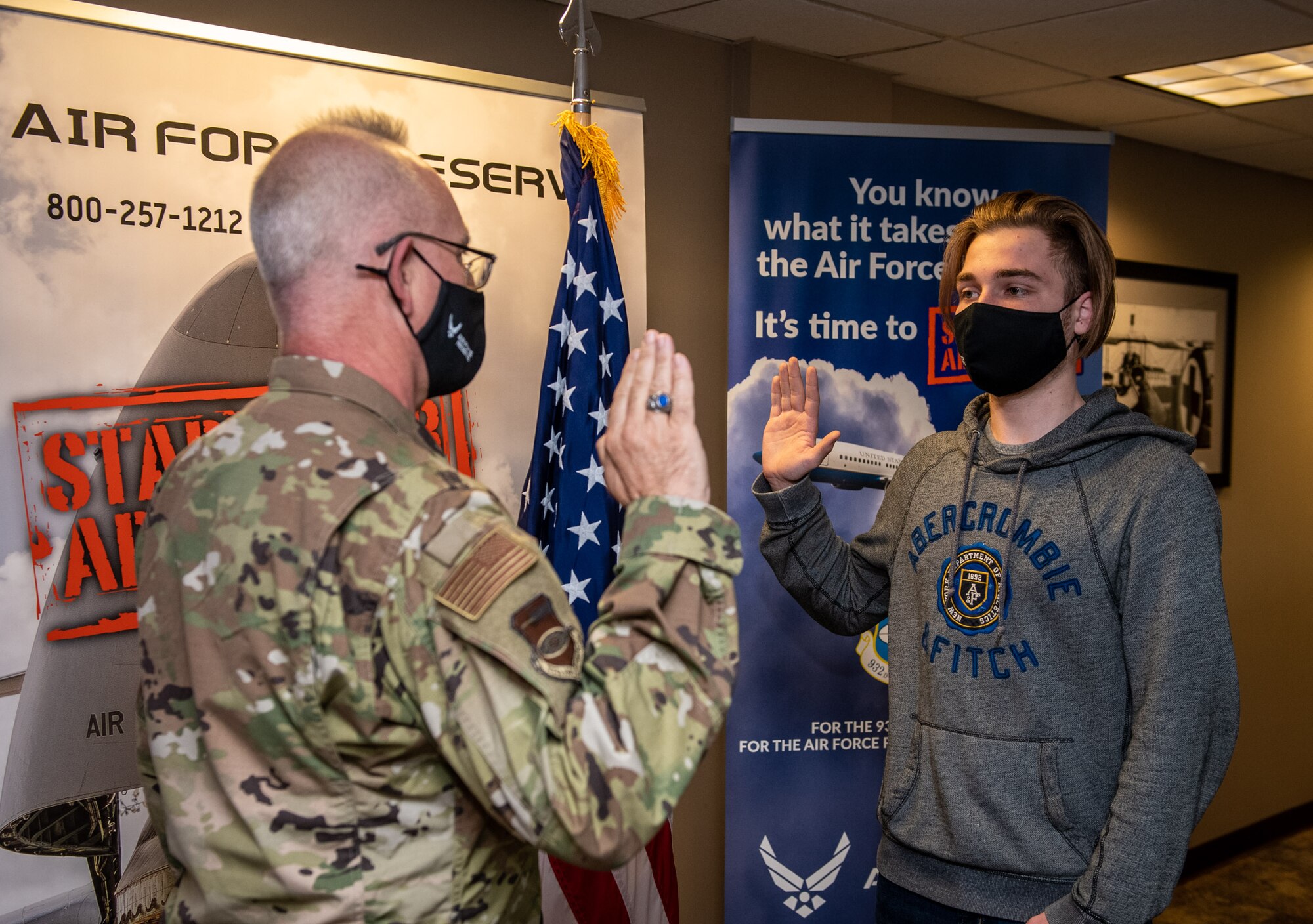 Bryce Ossman, newest recruit to join the 932nd Airlift Wing, recites the oath of enlistment given by Lt. Col. Stan Paregien, 932nd Airlift Wing Public Affairs Officer, during an enlistment ceremony, April 8, 2021, at the 932nd AW Headquarters building, Scott Air Force Base, Illinois. (U.S. Air Force photo by Christopher Parr)