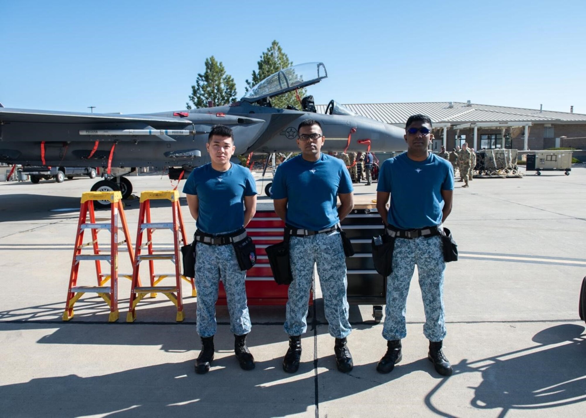 Three Republic of Singapore Airmen pose for a photo.