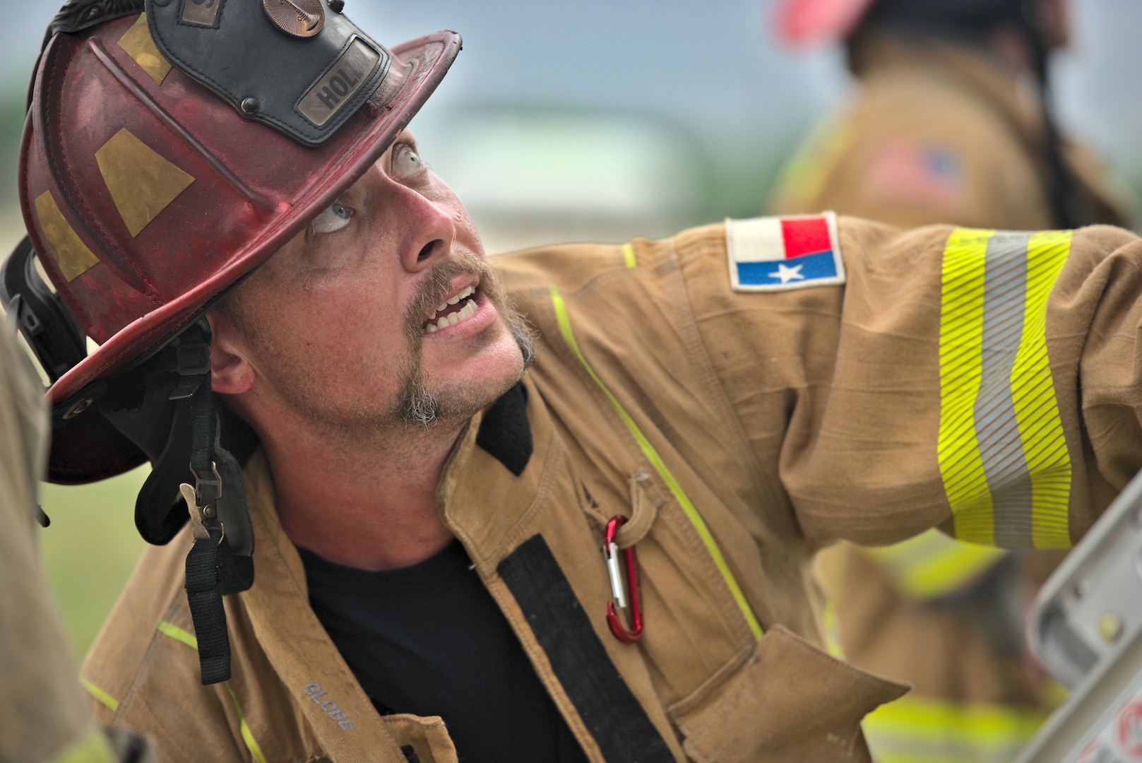 Schertz Fire Rescue Lt. Tom Hollick, lead instructor, demonstrates how to position a ladder during training at Joint Base San Antonio-Randolph, Texas, April 12, 2021.