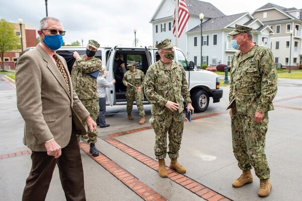 NORFOLK (Apr. 19, 2021) Adm. Bill Lescher, U.S. Navy Vice Chief of Naval Operations, left, is greeted by Adm. Christopher W. Grady, commander, U.S. Fleet Forces Command (USFFC) during a trip to Hampton Roads. USFFC trains, certifies, and provides combat-ready Navy forces to combatant commands that are capable of conducting prompt, sustained naval, joint and combined operations in support of U.S. national interests.